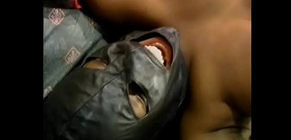  Busty ebony babe in a leather black mask takes a hardcore pounding from behind like a good slut